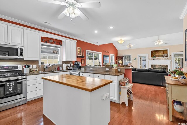 637 Sparrow Dr, Surfside Beach, SC 29575 - kitchen featuring wood counters, a peninsula, stainless steel appliances, and ceiling fan