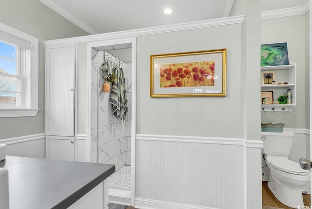 637 Sparrow Dr, Surfside Beach, SC 29575 - full bathroom featuring toilet, ornamental molding, wainscoting, tiled shower, and vanity