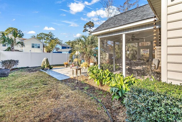 637 Sparrow Dr, Surfside Beach, SC 29575 - view of yard featuring a patio, fence, and ceiling fan