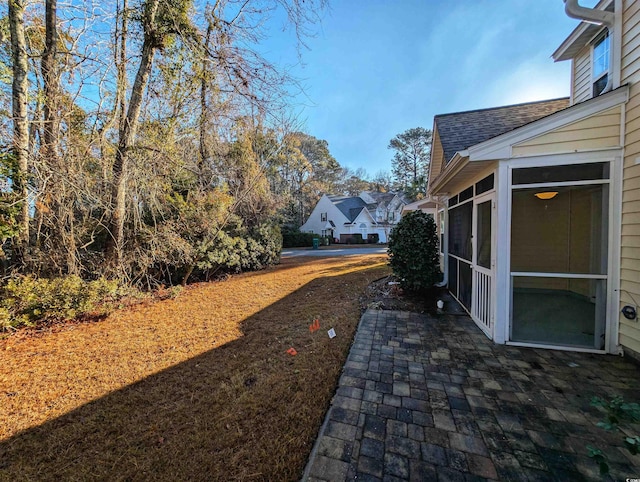 view of yard with a sunroom