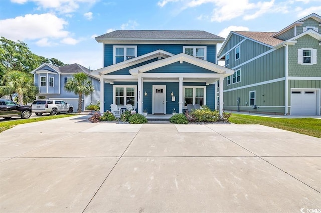 view of front of home with a garage and covered porch