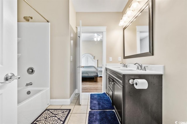 bathroom featuring tile patterned flooring, vanity,  shower combination, and ceiling fan