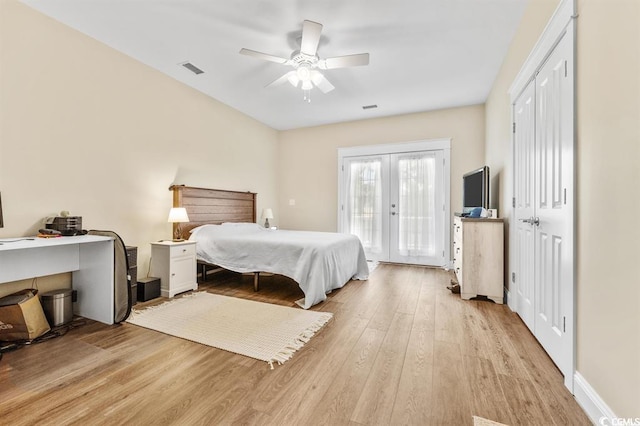 bedroom featuring access to outside, light hardwood / wood-style floors, french doors, and ceiling fan