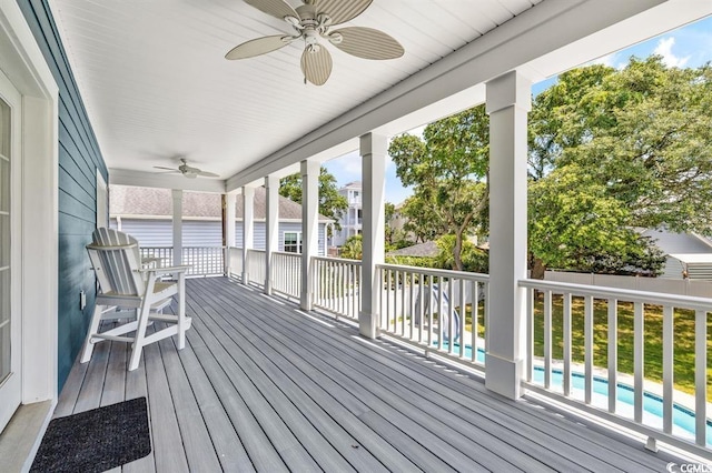 wooden deck featuring ceiling fan