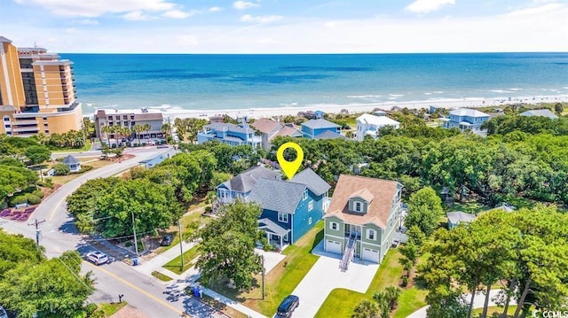 birds eye view of property featuring a view of the beach and a water view