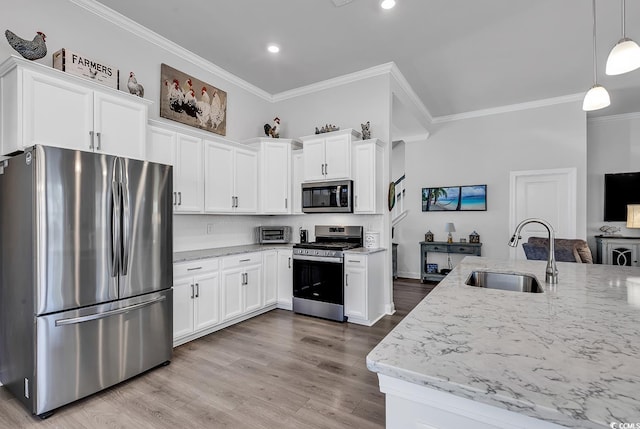 kitchen with ornamental molding, stainless steel appliances, light stone counters, and a sink