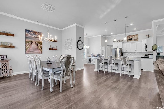 980 Desert Wheatgrass Dr, Myrtle Beach, SC 29579 - dining area with ornamental molding, dark wood-type flooring, recessed lighting, an inviting chandelier, and baseboards