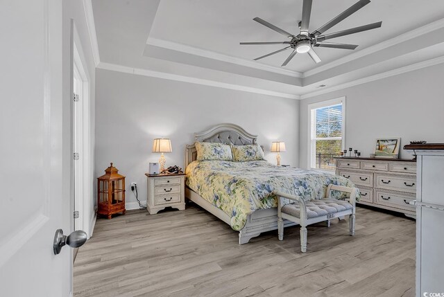 980 Desert Wheatgrass Dr, Myrtle Beach, SC 29579 - bedroom with light wood finished floors, a raised ceiling, and ornamental molding