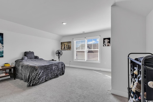 carpeted bedroom featuring vaulted ceiling