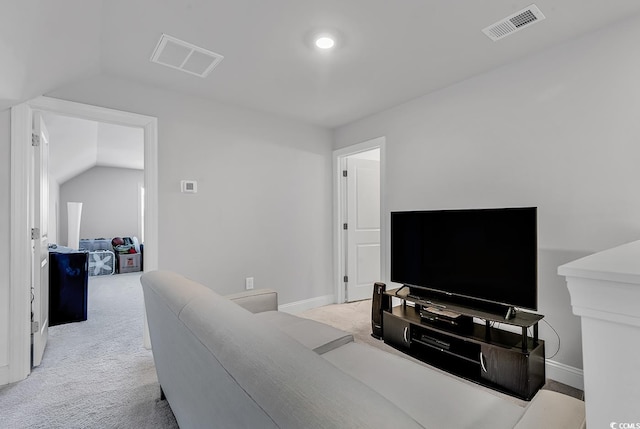 living room featuring lofted ceiling and light carpet