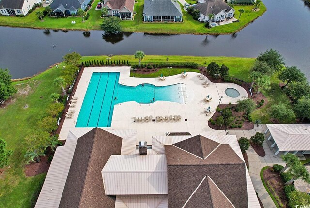 view of pool featuring a water view