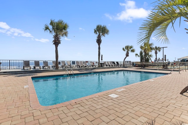 view of swimming pool with a patio