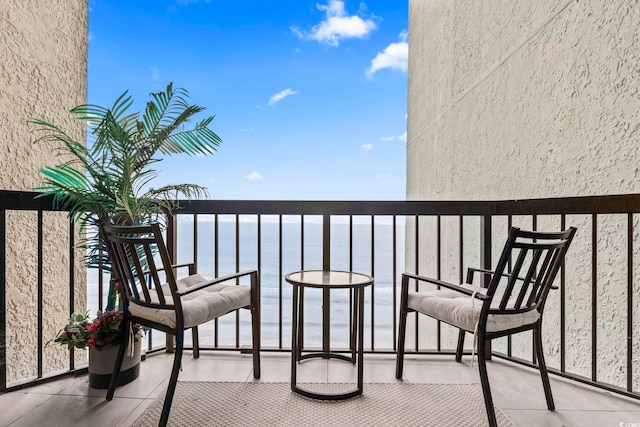 balcony featuring a water view