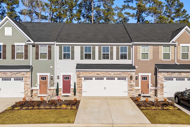 multi unit property featuring a garage