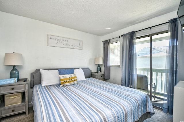 bedroom featuring a textured ceiling and carpet flooring