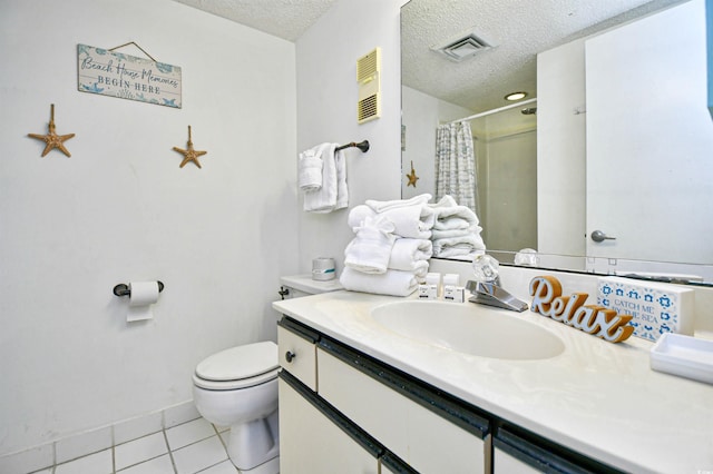 bathroom with a shower with shower curtain, vanity, a textured ceiling, tile patterned floors, and toilet