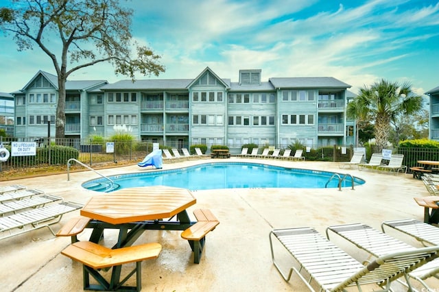 view of pool featuring a patio