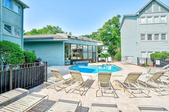 view of pool featuring a patio area