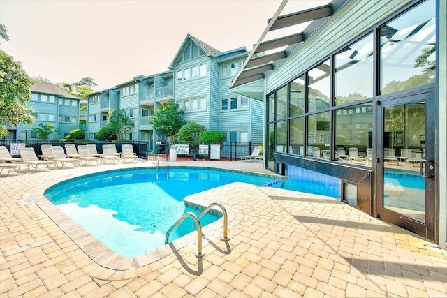 view of swimming pool featuring a patio