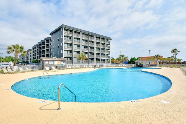 view of swimming pool featuring a patio area