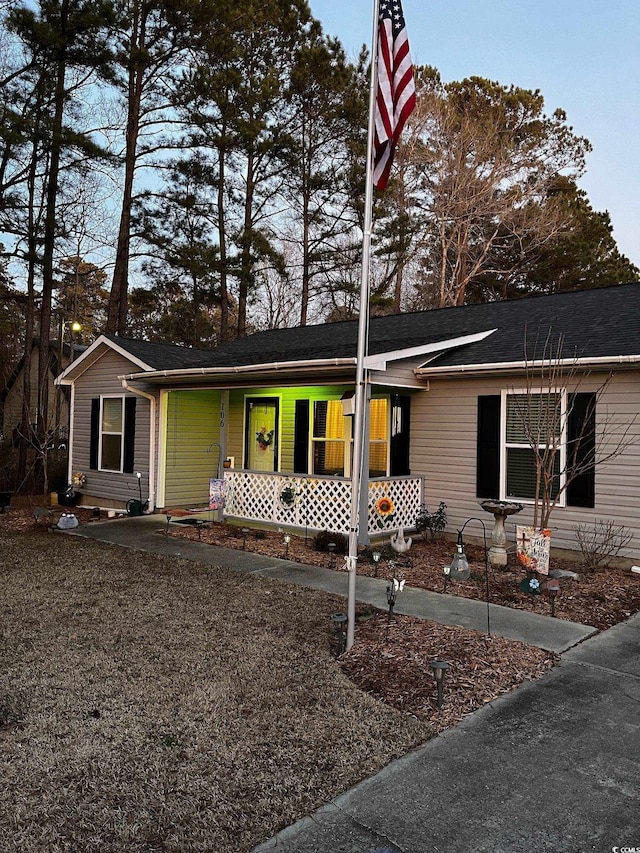 ranch-style home featuring covered porch