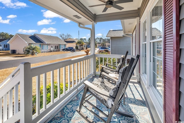 balcony with ceiling fan and covered porch