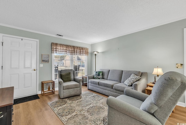 living room featuring hardwood / wood-style flooring and ornamental molding