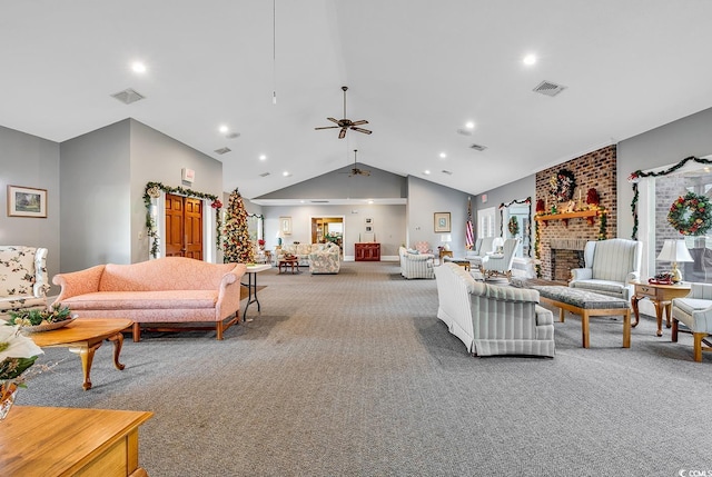 living room featuring ceiling fan, lofted ceiling, carpet floors, and a brick fireplace