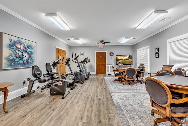 exercise room featuring crown molding, ceiling fan, and light hardwood / wood-style flooring