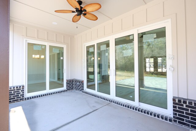 view of patio featuring ceiling fan