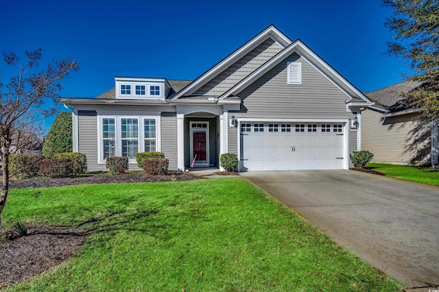 view of front of property featuring a garage and a front yard