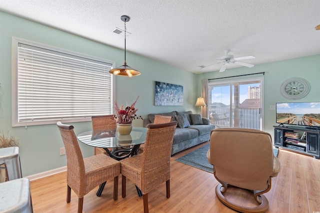 1900 Duffy St Unit C-7, North Myrtle Beach, SC 29582 - dining space with light wood-style floors, ceiling fan, a textured ceiling, and visible vents