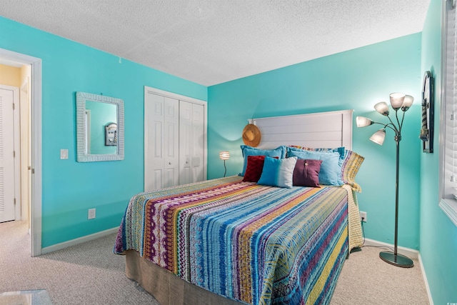 1900 Duffy St Unit C-7, North Myrtle Beach, SC 29582 - bedroom featuring a closet, baseboards, carpet flooring, and a textured ceiling