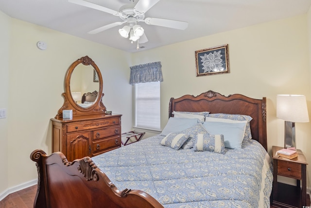 bedroom with wood-type flooring and ceiling fan