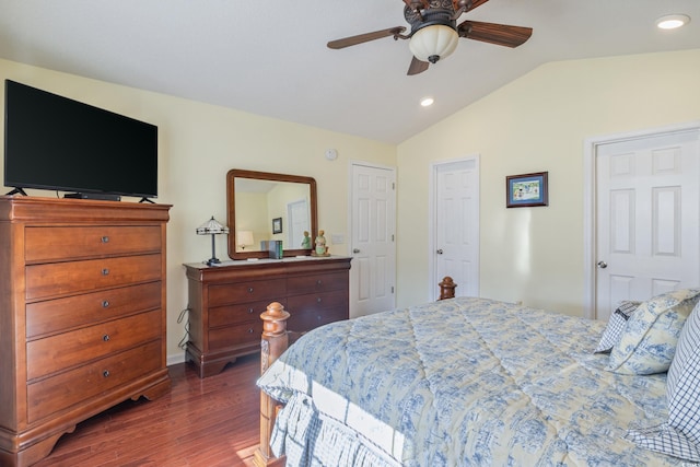 bedroom featuring ceiling fan, dark hardwood / wood-style floors, and vaulted ceiling