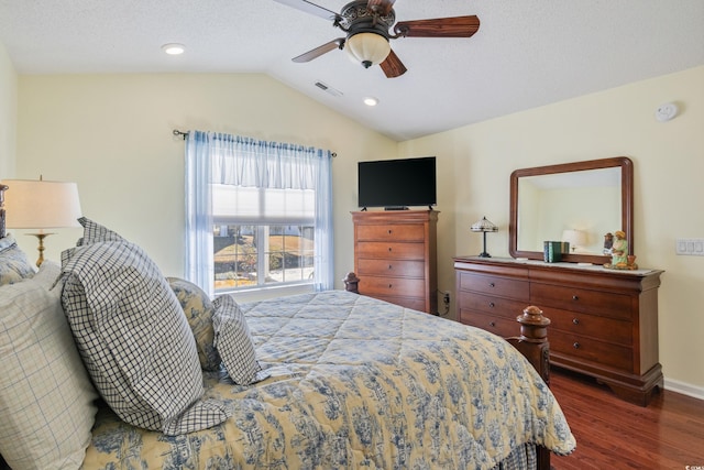 bedroom with lofted ceiling, dark hardwood / wood-style floors, and ceiling fan