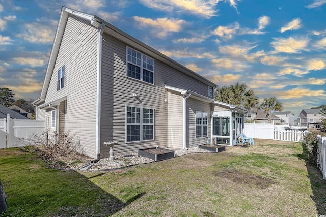 back of house with a yard