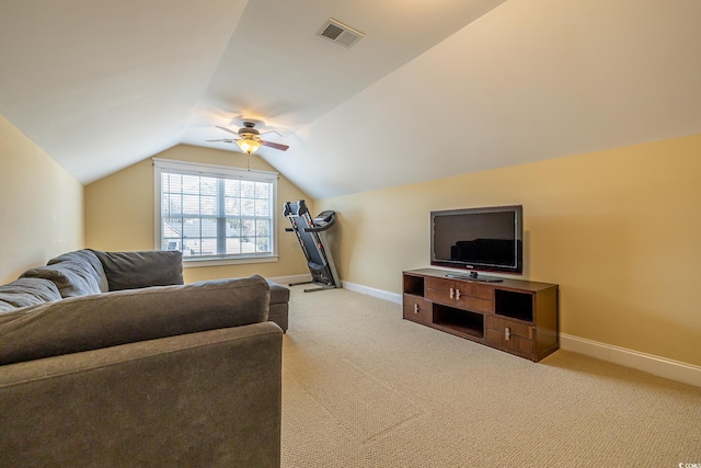 living room featuring vaulted ceiling, light carpet, and ceiling fan