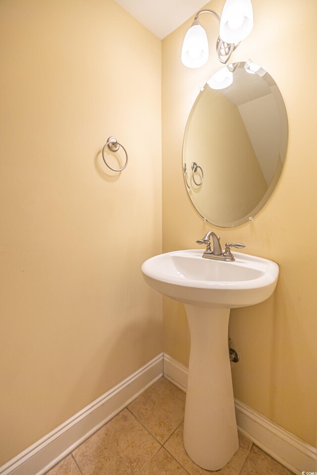 bathroom featuring sink and tile patterned flooring