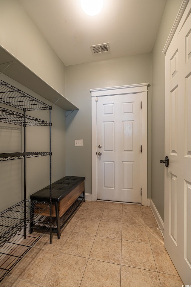 mudroom with light tile patterned floors