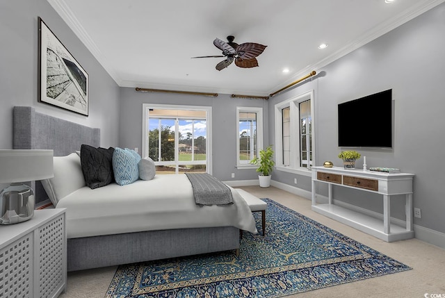 bedroom with crown molding, carpet floors, and ceiling fan