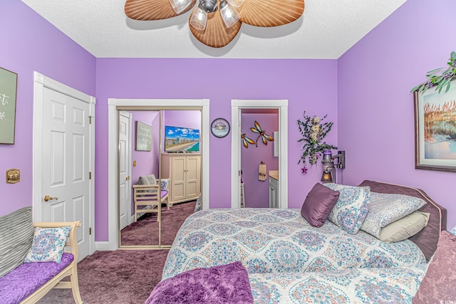 carpeted bedroom featuring a textured ceiling and ceiling fan