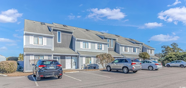 exterior space with uncovered parking and a residential view