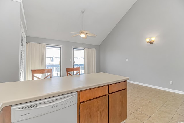 kitchen featuring baseboards, dishwasher, lofted ceiling, ceiling fan, and light countertops