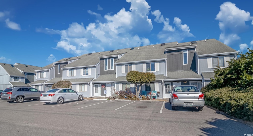 exterior space with uncovered parking and a residential view