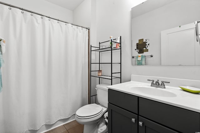 bathroom with a shower with shower curtain, vanity, toilet, and tile patterned flooring