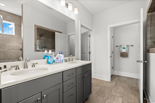 bathroom featuring vanity, tile patterned floors, and a shower