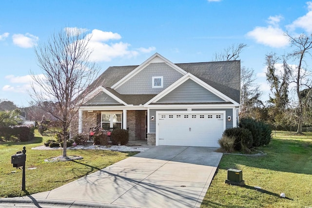 craftsman-style home featuring a garage and a front yard