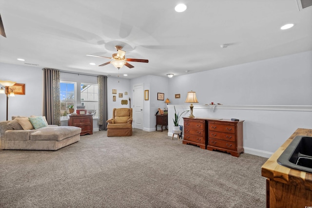 interior space featuring carpet floors and ceiling fan