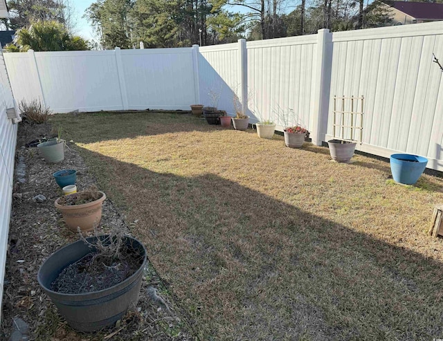 view of yard with a fenced backyard